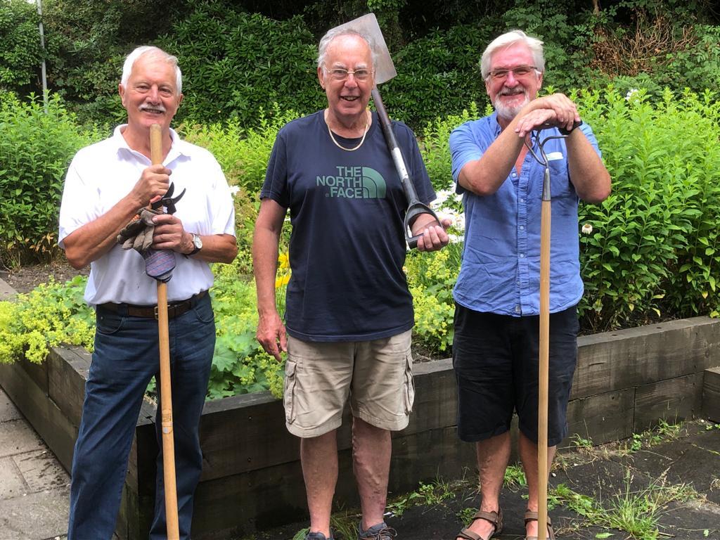Photo shows three willing Members giving a helping hand in the Sight Cymru's garden in Pontypool.
