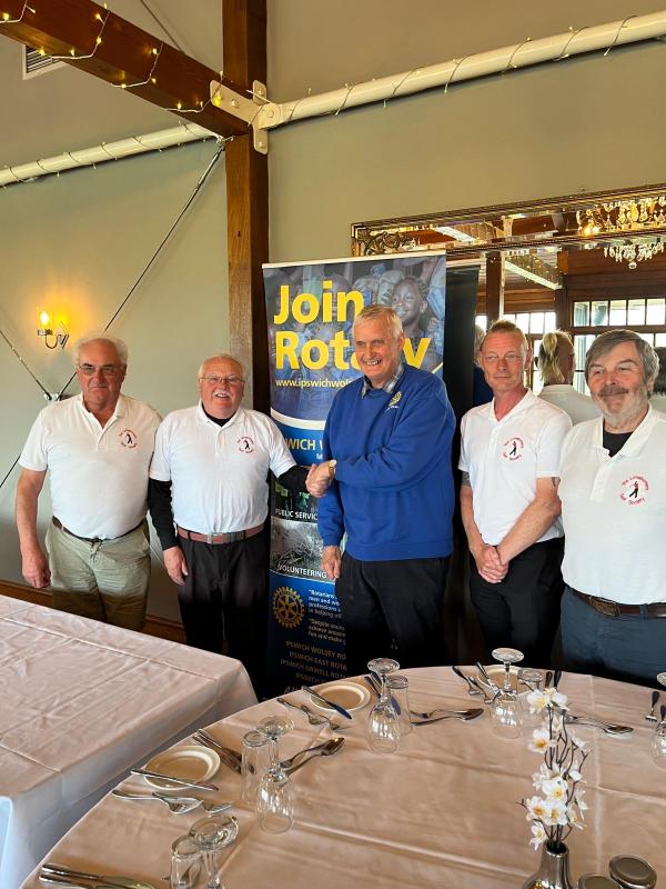Their captain, James Sheridan, also won the individual prize. He is pictured with the rest of his team shaking hands with Wolsey President David Wilson.