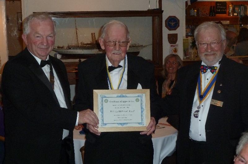 PP Ian McDowall being presented a certificate for 50 years service