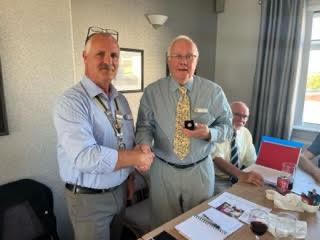 Sapphire Secretary Graham - President Martin (left) presents the pin to Graham