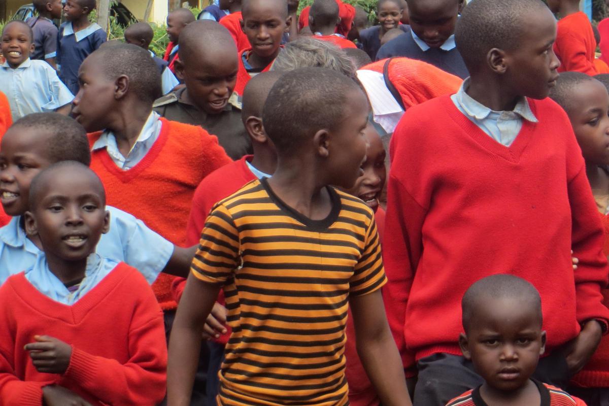 A large group of smiling African boys