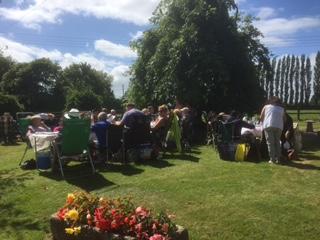 Guests in the delightful front garden of the house built in the 1700's.