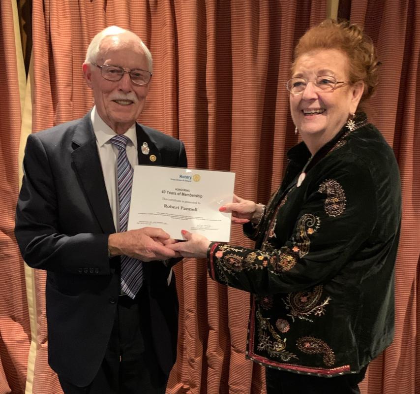 Honours for Club members - Bob Pannell receiving a Certificate marking 40 years in Rotary