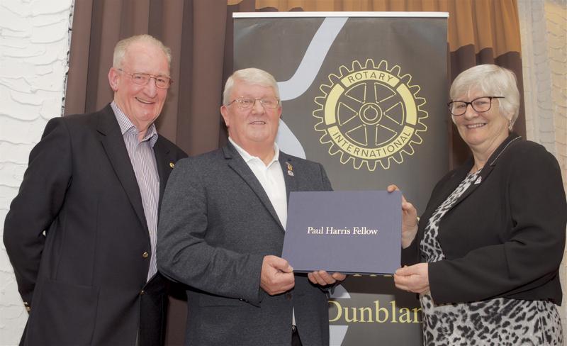 John Kilby with District Governor Ian Dowe presenting Paul Harris Fellowship to Breda Seaman in Dunblane 