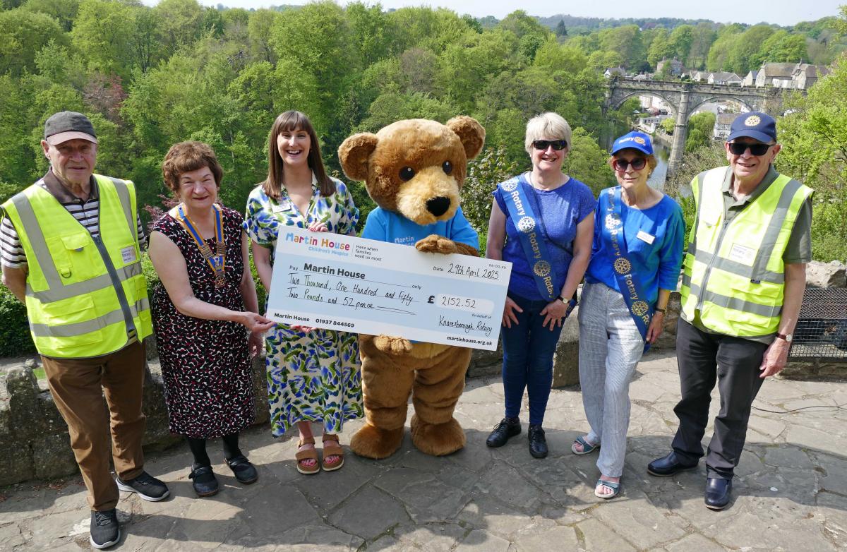 Photo shows, left to right, Rotarian Mike Dixon, Knaresborough Rotary President Helen Westmancoat, Martin House Regional Fundraiser Rebecca Taylor, Marty Bear, Knaresborough Rotary President Elect Deborah Wilson, Vice President Stephanie Blevins and 