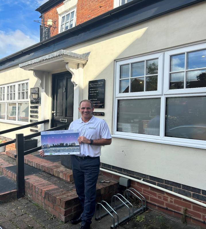 Pete Townsend, proprietor of Kenilworth Chiropractic Clinic holding the new Calendar.