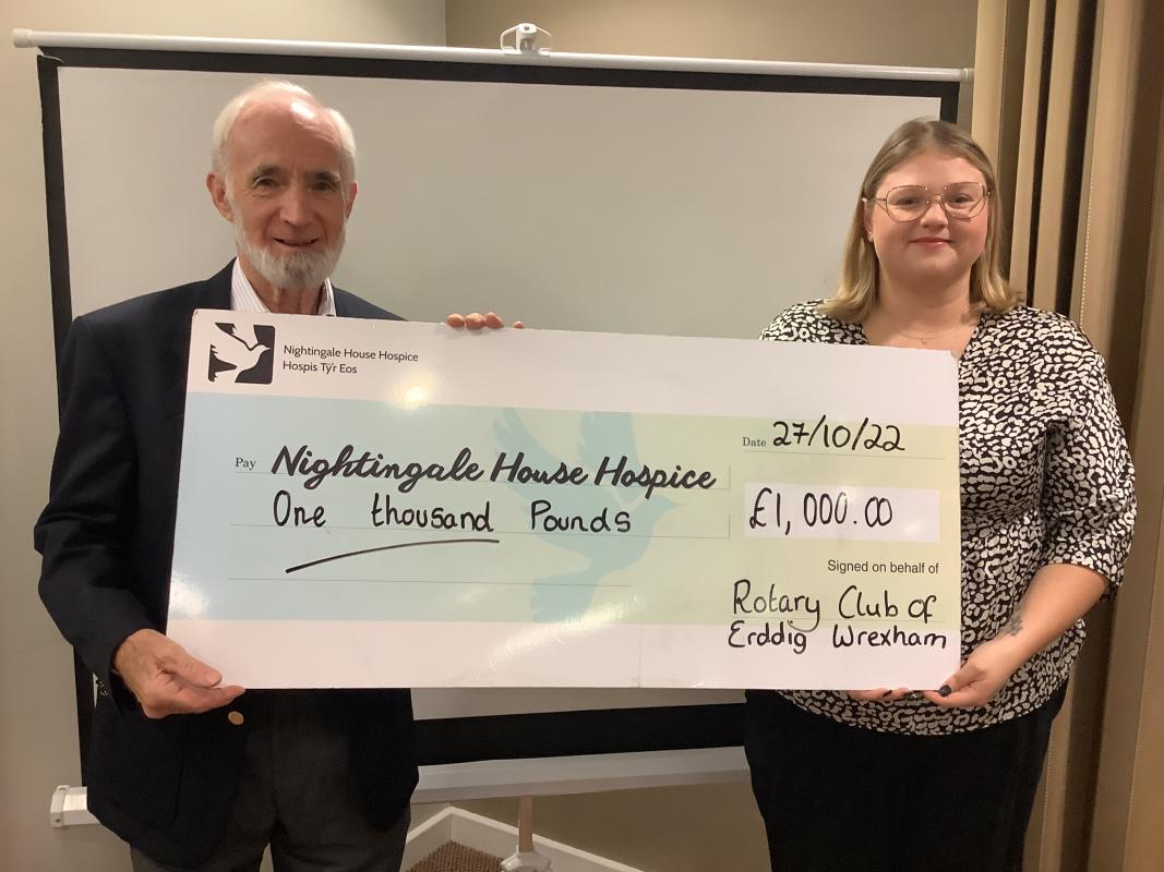 President Robin presenting a cheque for £1000.00 to Nightingale House