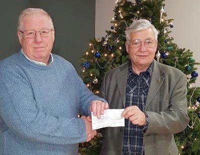 President Phil handing over a £300 Grant Cheque to Bryn Appperly