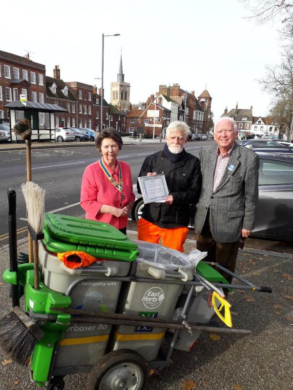 The photo shows Andy (centre) receiving his award from Prue Dixon, Baldock Rotary President and Rotarian Michael Muir