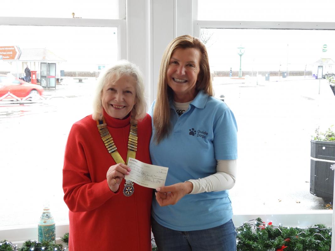 President Angela presenting cheque to Fiona Toms from the Guide Dogs