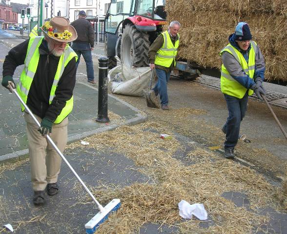 Members enjoying themselves clearing up after our Roll the Barrel event on Denbigh High Street on Boxing Day 2011 !