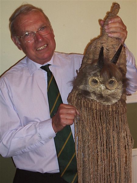 Norman Davis with Ceremonial Mask, a souvenir of his time spent in Kenya