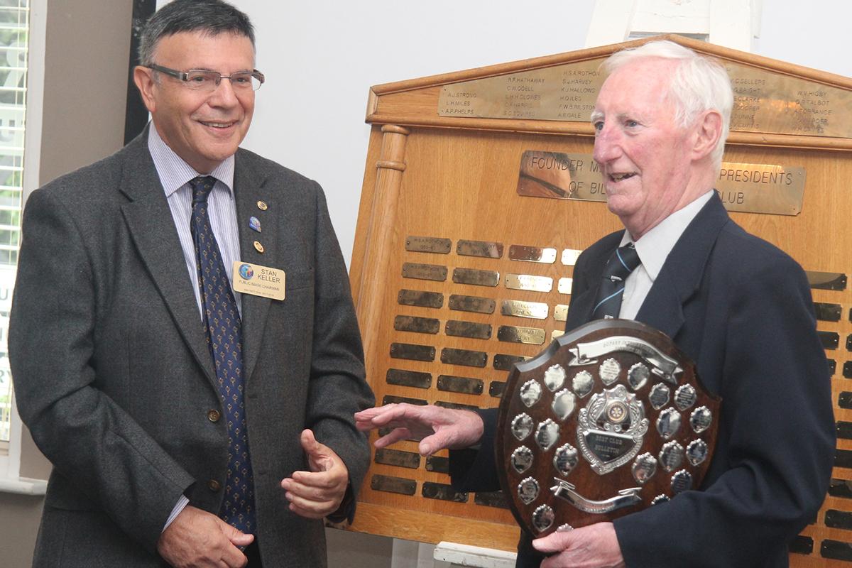 Trevor receiving the award from District Chairman Stan Keller