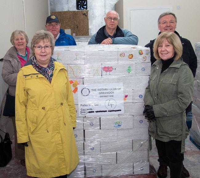 Shoebox Project  - Shoebox Convenors Elma Paton and Finlay Sim get help as they prepare to send the pallets on the next step of their journey 