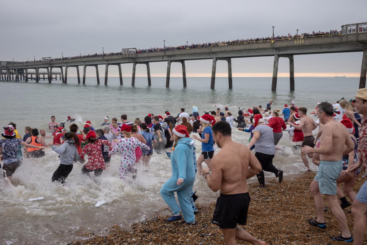 Dippers entering the sea near Deal Pier