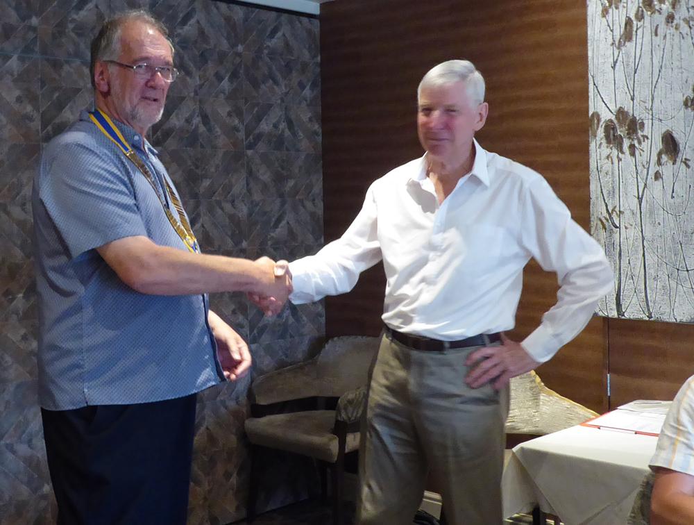 President Brian James (R) hands over to President Richard Attenborough (L) 