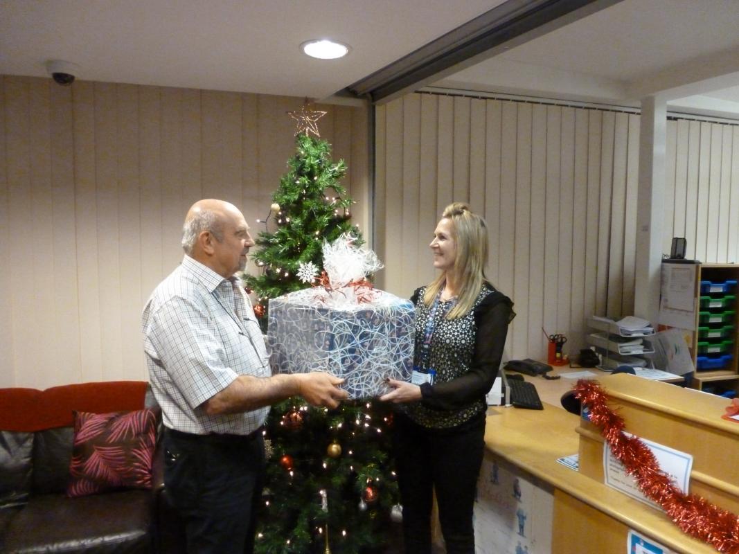 Bob Guard from the Rotary Club of Wakefield Chantry, hands over the very last hamper to be distributed to Julie Westbroom (Cedars Children Centre) for one of the families.