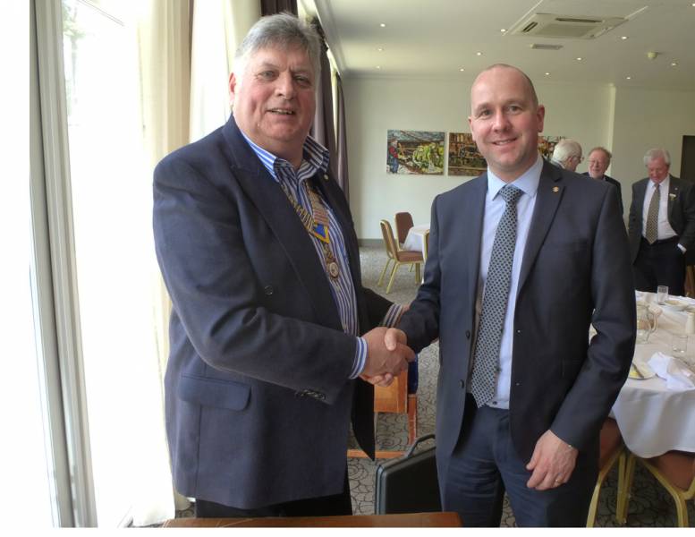 President Ian welcomes Rotarian Mike Sellers to the World of Rotary.