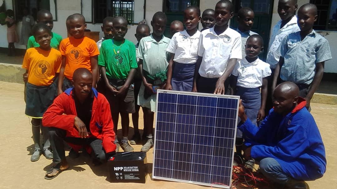 Planting for Hope, Uganda - Update - Students with the first solar panel 