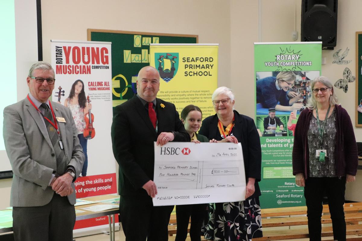 From the left:  Rotarian Paul Vaesen, Headteacher Chris Davey and pupil member of the choir, Vice President Ann Reed and Head of Music Kate Steer