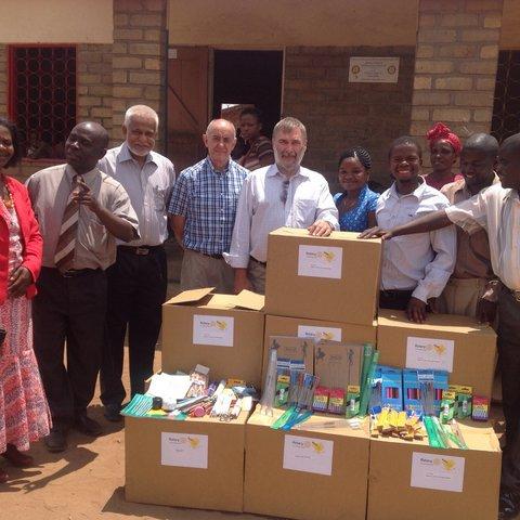 President Mike Kitchen presenting Boxes to a school in Malawi in 2015