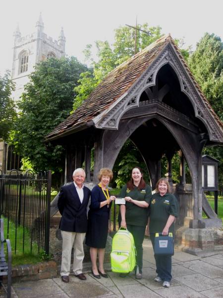 Vice President, Annabel King, and Rtn Dr. Barry Kempton, handing a cheque for £500 to Sarah Mackay, Lambourn CFR Co-ordinator.