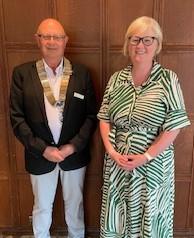 President Derek Porter presenting the TRCS cheque to Gillian Baillie for the Marr Minis a volunteer led club for children from pre-school to Primary 7 in Troon and locality to play sport, learn teamwork and rugby skills.
