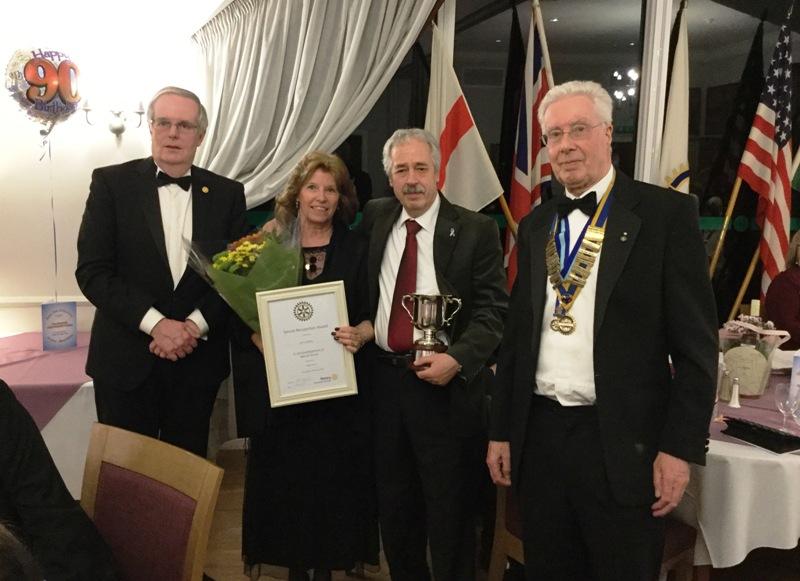 Gerrie and Chris Bailey receive their Award from President Mike Clutton (right) and Rotarian Philip Jones (left)