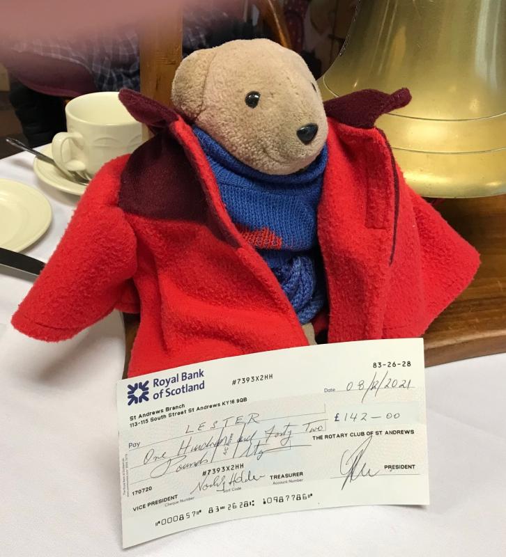 Donation to Lester the teddy bear - Lester with his cheque for £142