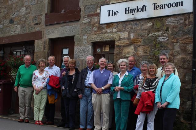 Well fed group in front of Marta's tearoom