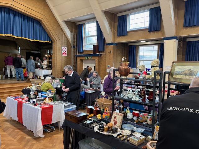 Stall holders and customers view the items on offer