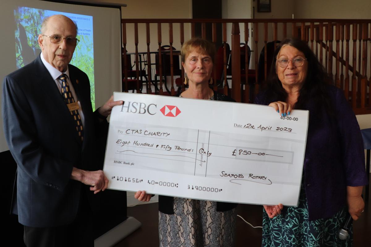 Tony Henley, Chair of International Committee and Vice President Mandy Davis presenting Michele Spencer (centre) with the donation cheque to CTAS
