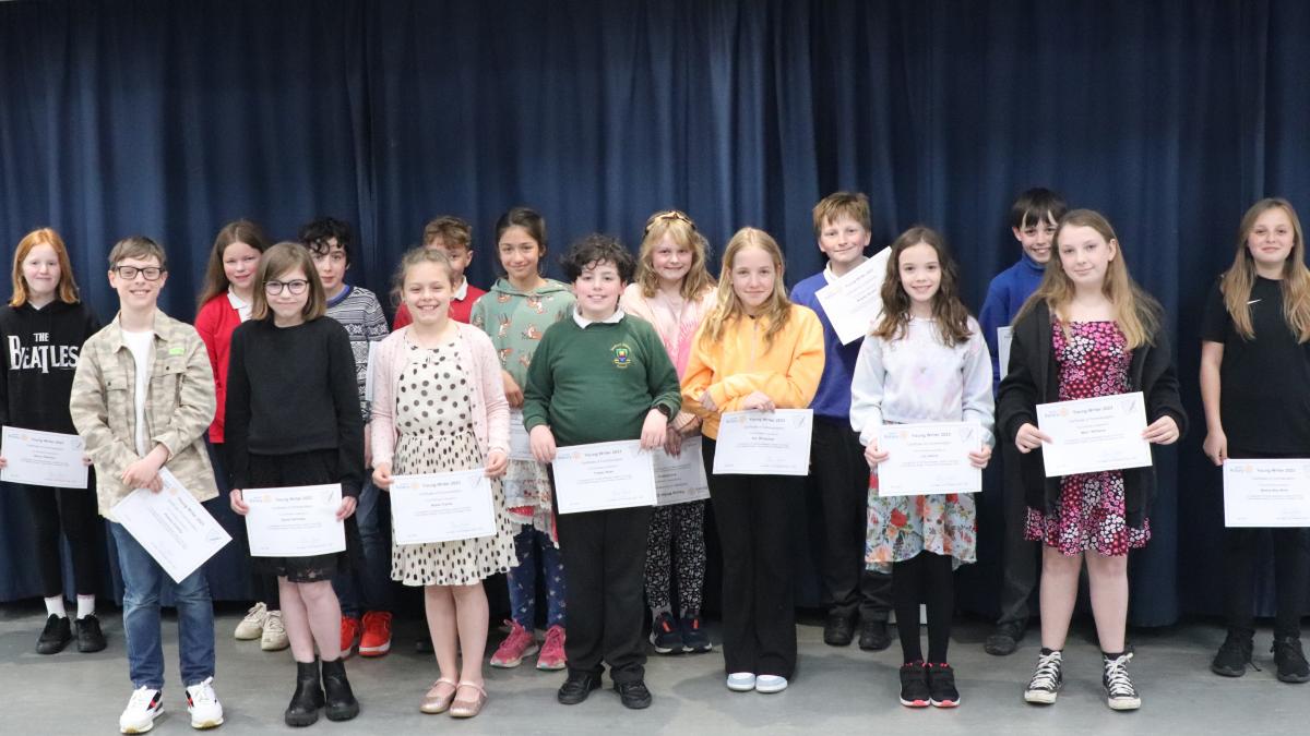The sixteen Young Writer finalists with their certificates
