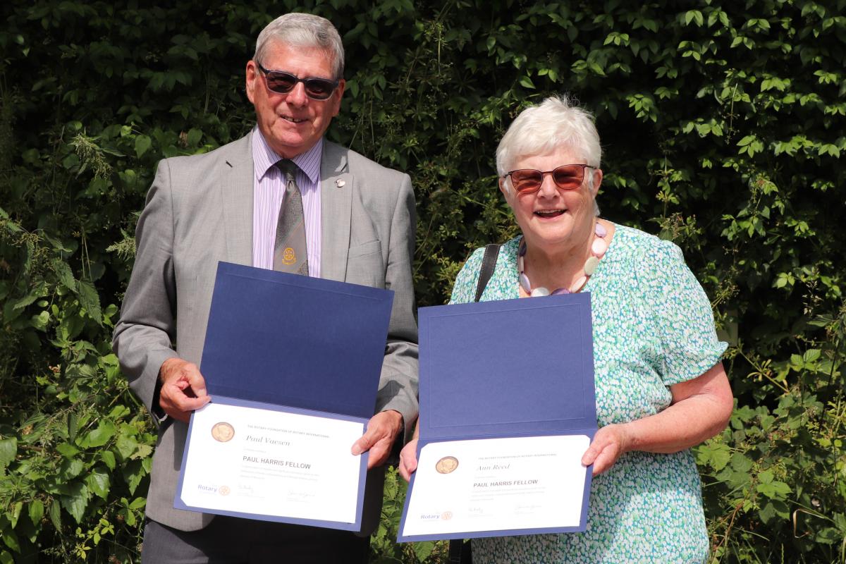 Past President Paul Vaesen and Immediate Past President Ann Reed with their Paul Harris Fellowship awards