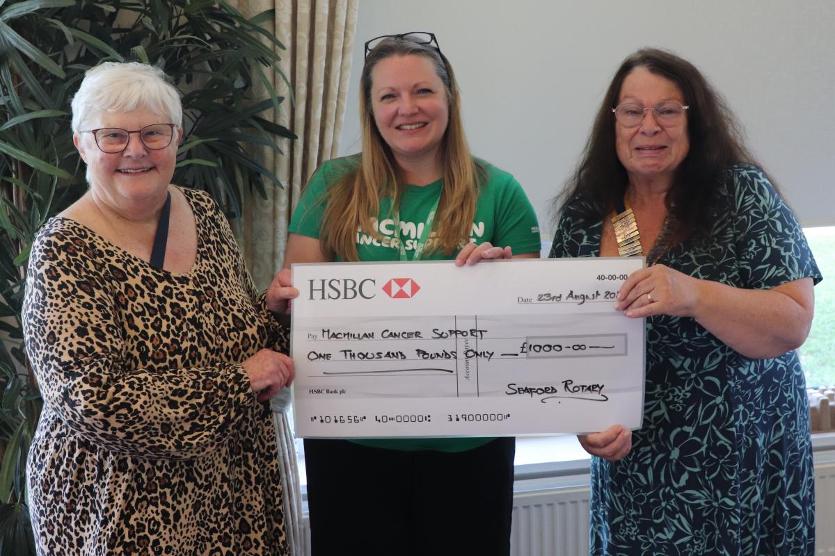 Presentation of the donation by Immediate Past President Ann Reed to Nyree Ashby from Macmillan Cencer Support with President Mandy Davis
