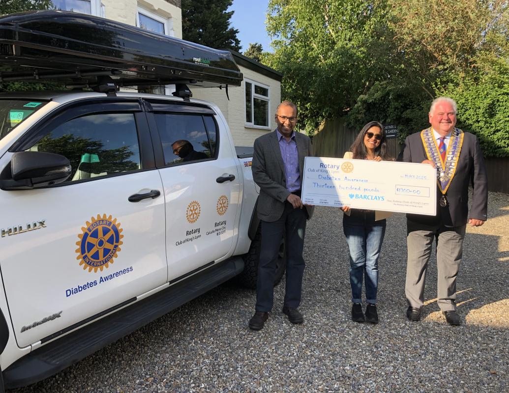 Presentation of cheque by President Paul Kunes to Dr Prabir Mitra and Sanjukta Mitra