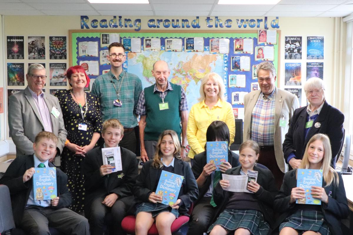 Back row:  Paul Vaesen, teachers Charlotte Davis and Robert Dale, Geoff Lowles, volunteer Sarah Laidlaw, David Pattenden and volunteer Ann Etheridge.  Front row:  Pupils with their dictionaries and calculators