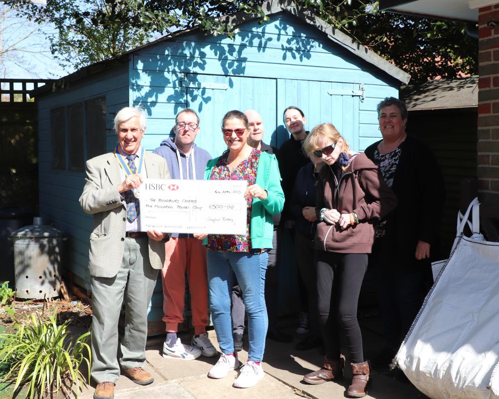 Barbara Billington, Deputy Manager, Bradbury Centre with some of the service users being presented with the grant cheque by President Clive Livingstone 