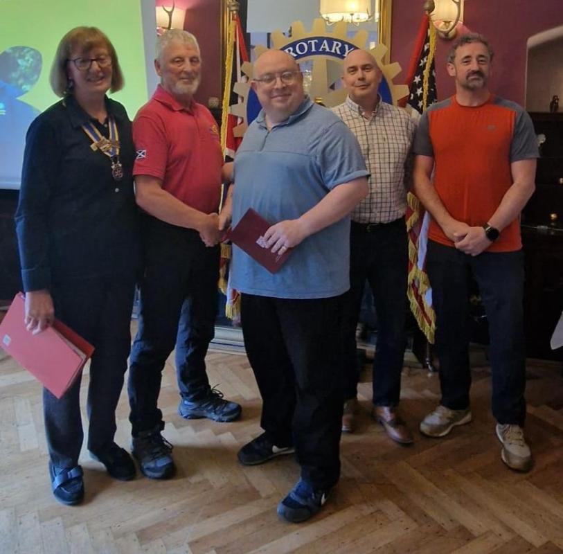 President Lindsey and sponsors welcome Rotarians Adam Stalker and Scott Spowage to the Club and to Rotary