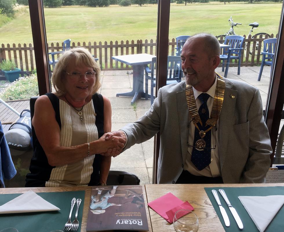 Irene Ogilvie being welcomed by President Alan Dunton