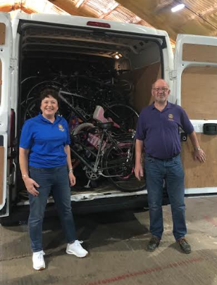 Jackie Wellman and Club President, John Cuthbertson, with the latest bike collection