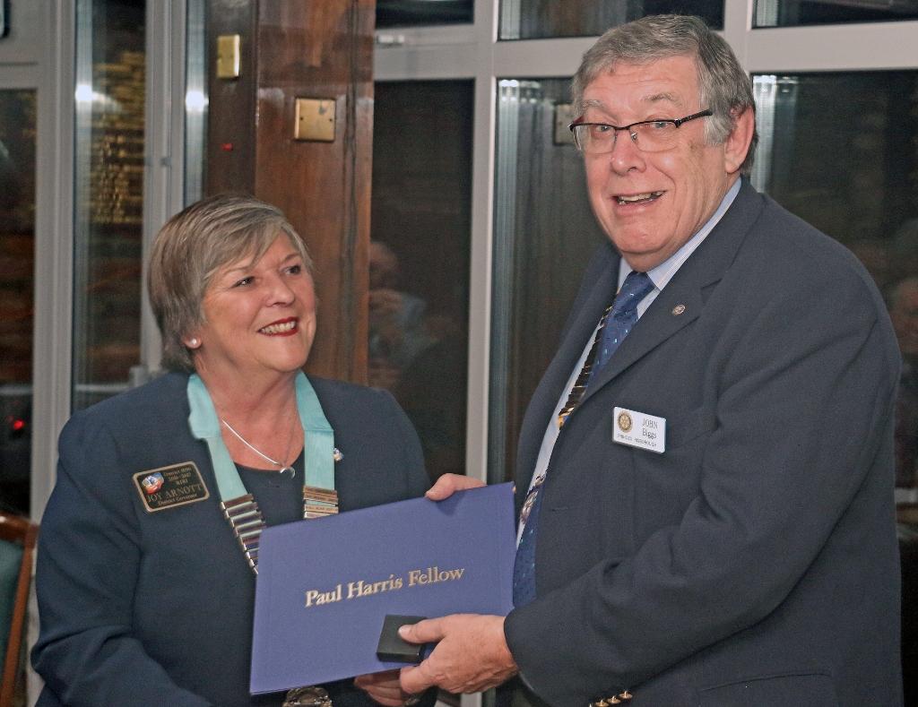 Rotary District Governor Joy Arnott presents John Biggs RCPR President his Paul Harris Fellowship award for his work on the Kop Hill Climb