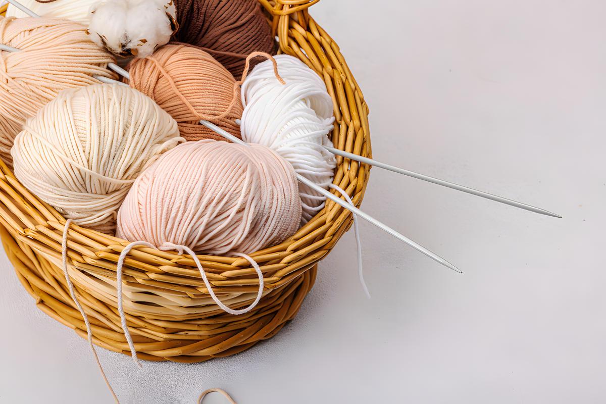 Knitting needles and wool in a basket