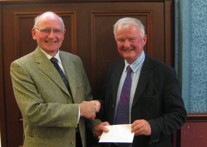 Club Member Peter Hall presents a cheque for £530 to Michael Toulmin of The Calvert Trust