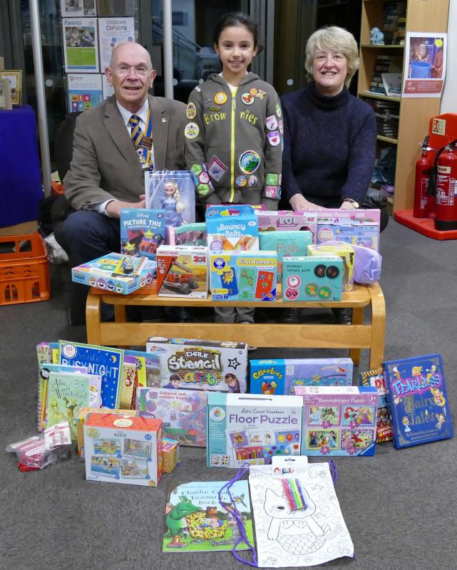 Annabelle (centre) with Knaresborough Rotary President David Kaye (left) and project co-ordinator Rotarian Debbie Wilson (right) and the toys collected by Annabelle.