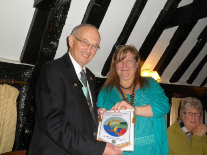 DG Ray Dixon visits RC of Chestfield - President Wendy Tetley presents DG Ray Dixon with Club Banner