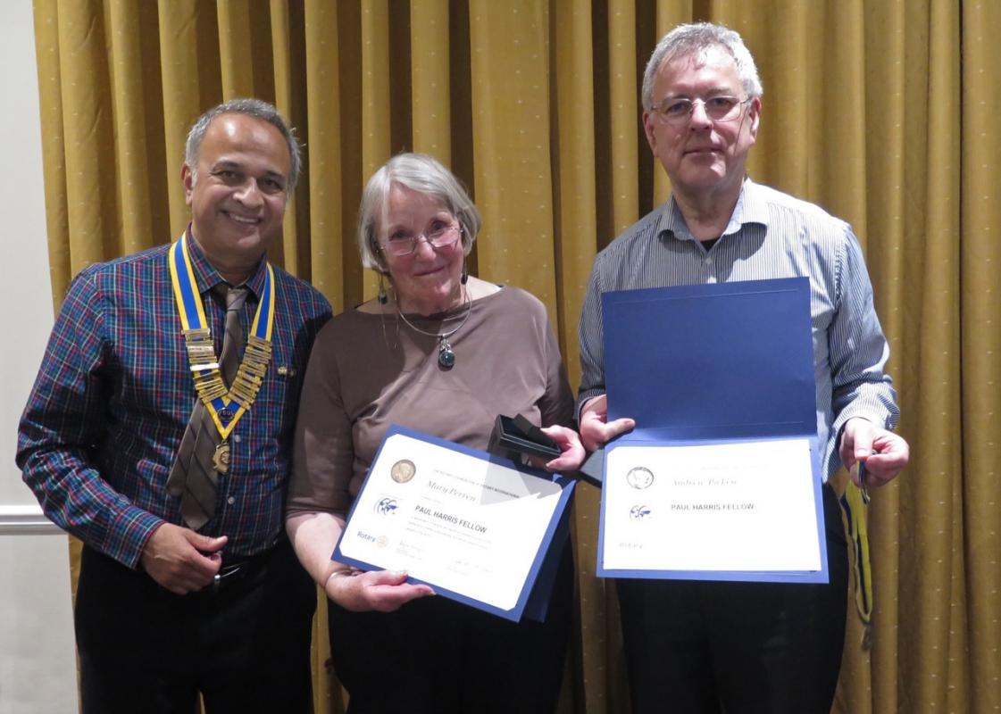 President Mukesh Patel presents Mary Perren and Andrew Picken with their awards