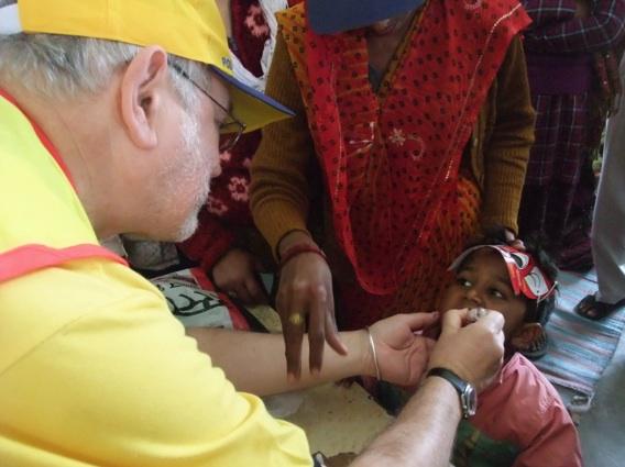 Rtn. Paul Harvey administering the vaccine