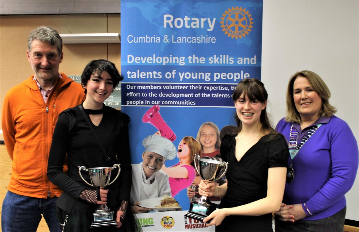 Keswick Rotarian Paul Bowmer with Cumbria and Lancashire Rotary Young Musician finalists Maisy Wallace and Anna Bray together with Rotary District Governor Kath Bromilow MBE PHF
