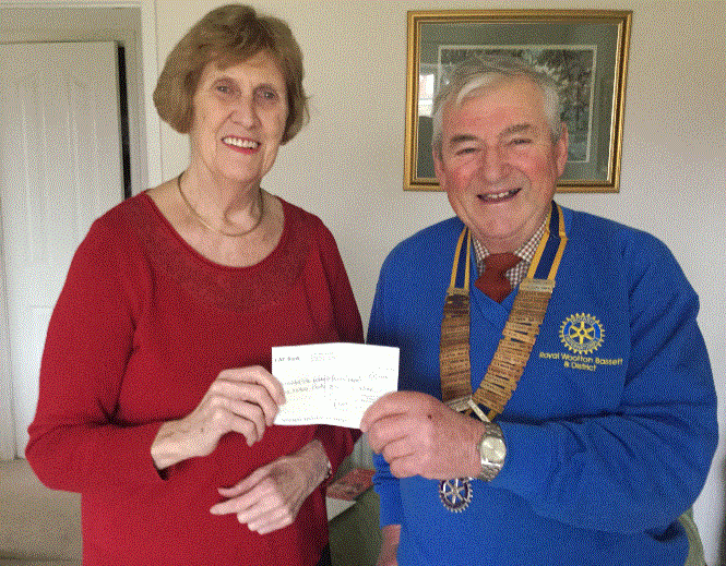 Ann Godfrey receiving a donation of £500 for Contact the Elderly in Royal Wootton Bassett. 